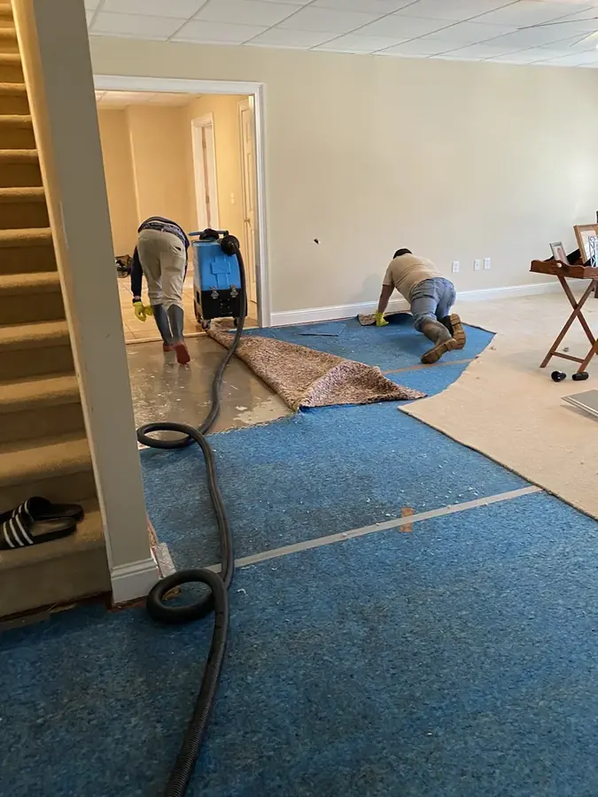 Flooded basement with standing water in an Easley, SC home after heavy rain