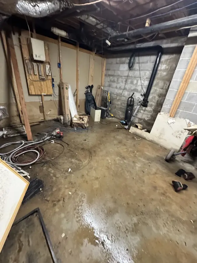 Sewage backup and contaminated black water on the floor of an Easley, SC home