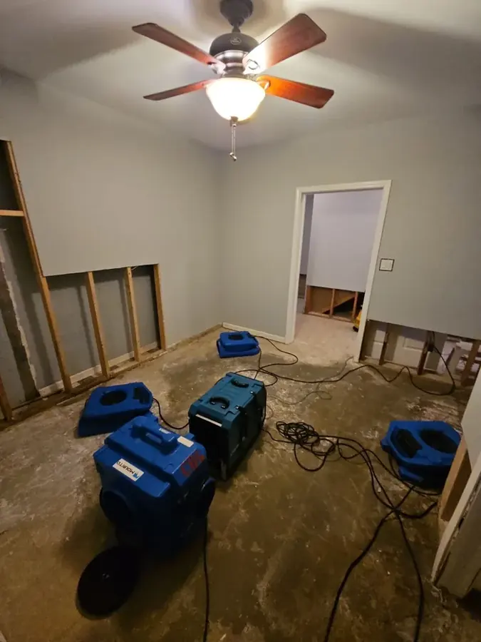 Air movers and dehumidifier drying a water damaged room in Easley, SC